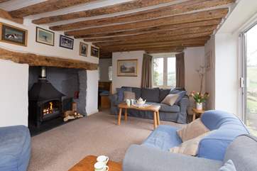 The sitting-room has a huge wood-burning stove and doors out to the patio.