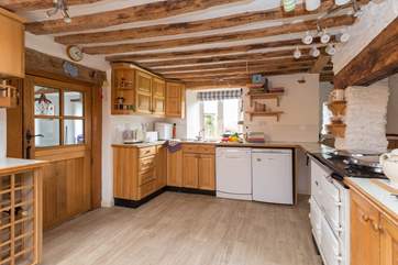 There is a large farmhouse-style kitchen.