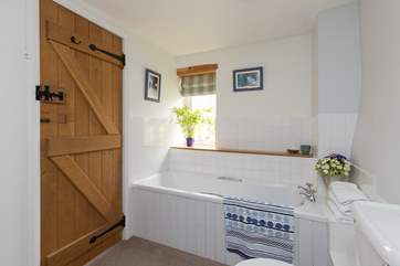 There is a family bathroom with doors to both the main part of the house and the part with the second staircase. In addition to the second upstairs shower-room, there is a shower and WC downstairs.