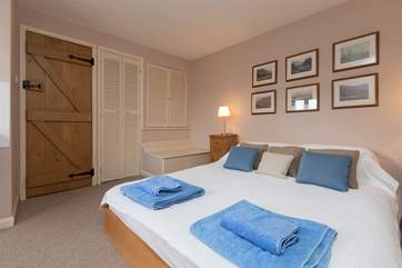 This double bedroom is at the far end of the house, with its own staircase up from the dining-room and a little shower-room too.