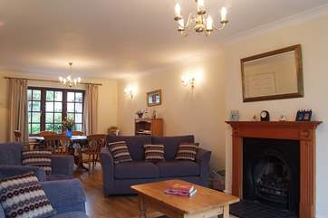 The spacious reception room with patio doors.