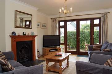 French doors lead from the sitting-room to the patio-area.
