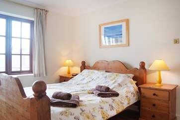 This bedroom has a king-size bed and lovely views over the marina (Bedroom 2).