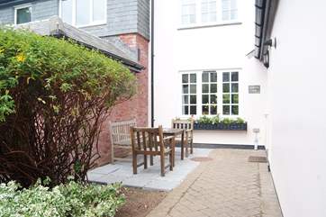 There is a sheltered sitting-area outside the front door which catches the afternoon sun.