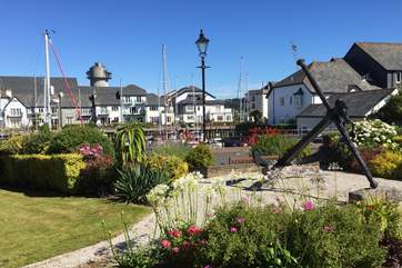 The communal gardens to the front of the house, with the marina directly beyond.