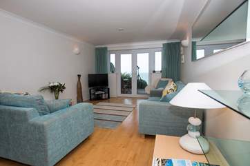 The stylish open plan sitting/dining-room.