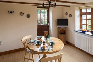 The back door leads out from the dining area to the sheltered patio.