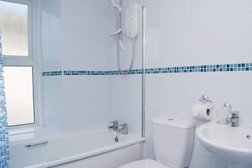 The modern first floor bathroom with a fitted shower.