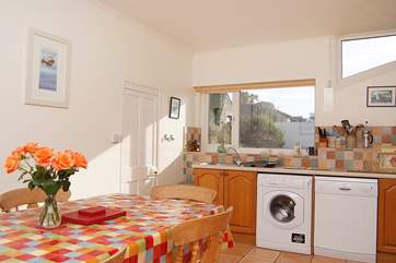 The spacious kitchen looks out over the huge garden.