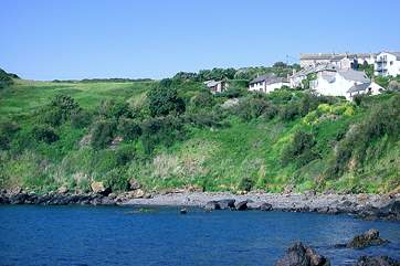 Skylight Barn is the last property from the right, perched high above Perprean Bay.