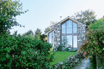 The exterior of Skylight Barn with floor to ceiling windows to make the most of the amazing views.