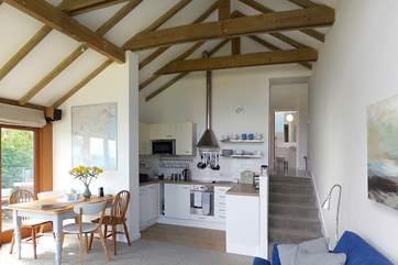 A view of the open plan living-area looking towards the stairs.