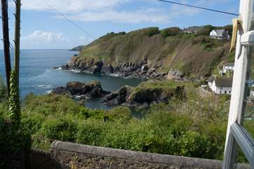 Both double bedrooms have stunning views over the garden to the cove below.