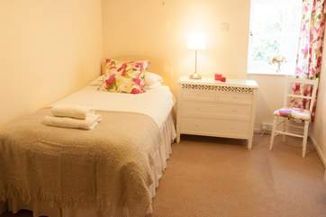 The pretty single bedroom is at the back of the cottage.