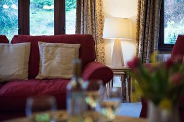 Plenty of windows let light flood into the sitting-room.