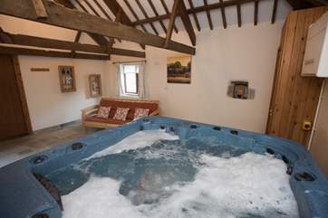 There is seating and books for relaxing in the garden-room.