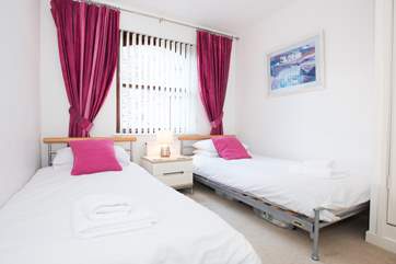Bedroom 2 has twin beds.