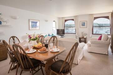 The dining table for six enjoys river views too.