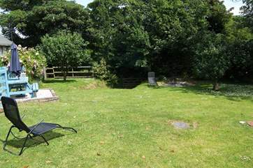 The spacious and enclosed back garden, room to play or simply relax.