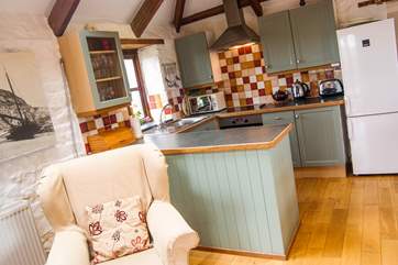 The kitchen-area looks out over fields.