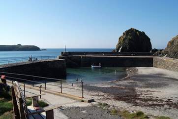 The harbour at Mullion Cove has a sandy beach at low tide.