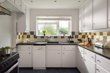 The light, airy kitchen looks out to the front of the property.