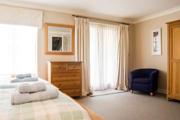 Bedroom 1 has doors out to a patio overlooking the lock (please take care with children).