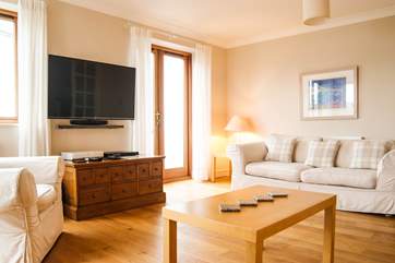 Comfortable sofas, sea views and a balcony...perfect for relaxation!