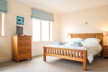 Bedroom 2 is on the second floor and has French doors opening to a Juliet balcony.