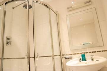 A corner shower in the en suite to Bedroom 2.