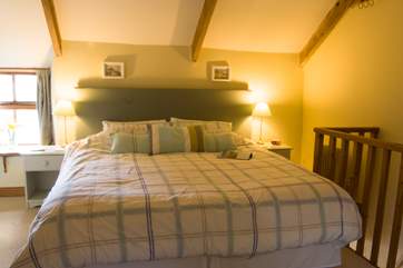 The spacious bedroom, with its en suite shower-room, has comfortable 'zip and link' beds, here shown made up as a 6ft double.
