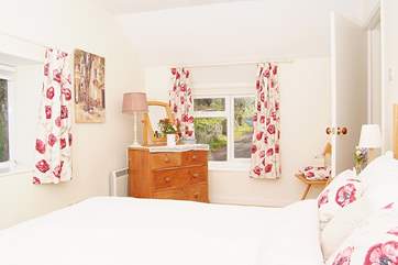 The double bedroom has windows on three sides and so is lovely and bright and cheerful.