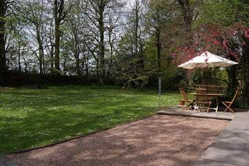There is a large patio and level lawn.Plenty of space for your dog to run around in this garden.