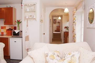 The bathroom and two bedrooms are along this hallway.