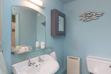 Looking at the bathroom from the other end of the room.