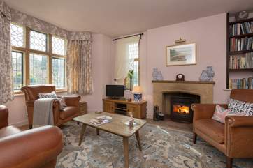 There is a lovely sitting-room with a wood-burner.