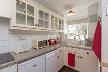 The contemporary kitchen looks out over a second private garden area that is just for guests at the Lodge.