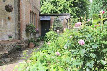 The outside details within the garden setting reflect the period of the Lodge.
