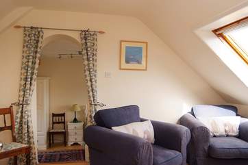 The upstairs sitting-area leading to the twin bedroom.