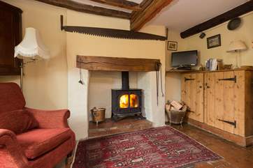 The living room with wood-burner could not be more cosy and welcoming. The cottage is filled with character.
