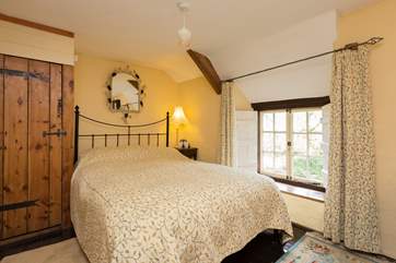 The double bedroom upstairs looks out to the front of the cottage.