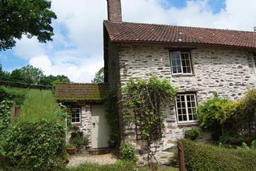 Week Cottage is has a delightful front garden and just to the left of the photo, a further garden with patio and BBQ area.