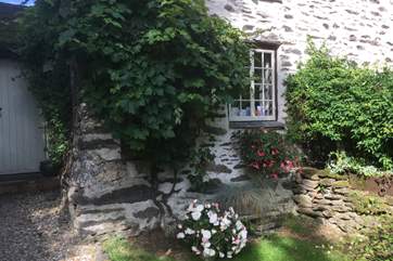 There is a very pretty little front garden as well as the larger side garden which has the barbecue.