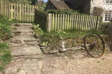 These are the stone steps up to the enclosed side garden, with seating and a built in BBQ.