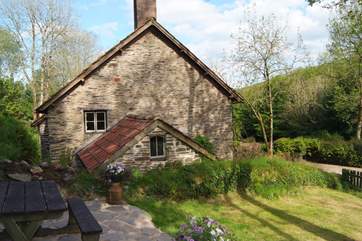 This is a view of the cottage from its own private enclosed garden. There are lovely views.