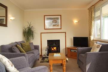 The sitting-room has a wood-burner for cooler evenings.
