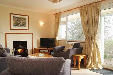 Plenty of light floods into the sitting-room.