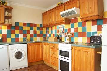 It is a pleasure to cook in such a lovely light room.