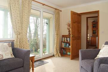 Patio doors lead out to the verandah and front garden.