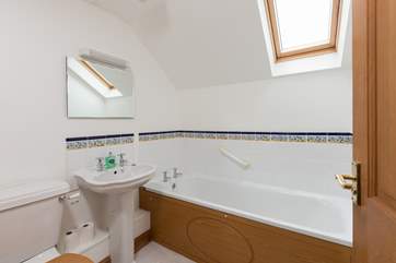 The bathroom is next to the twin bedroom.
